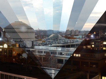 Image of MIT campus taken from a rooftop, made up of many individual photographs in the shape of triangular beams.